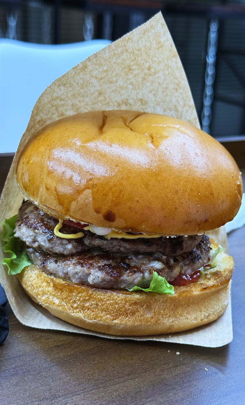 A double patty in a soft bun on paper